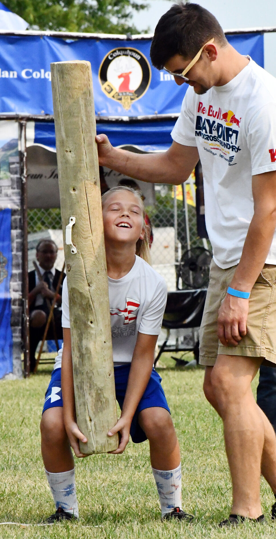 Cameron Garlik lifts a log
